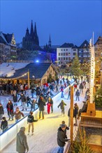 Ice rink at the Christmas market on the Heumarkt in the old town of Cologne, Cologne Cathedral,