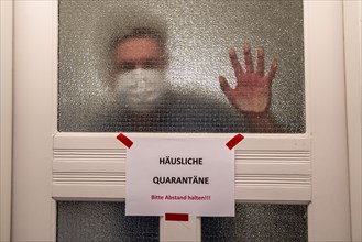 Symbolic image Domestic quarantine, man is in isolation at home due to a suspected corona