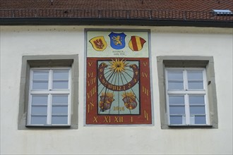 Wall sundial on the façade of the castle, from 1616, double number band, above the dial on the left