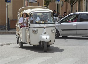 Three-wheeled scooter Ape by Piaggio in a street in Matera, Basilicata, Southern Italy, Italy,