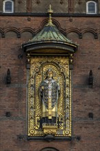 Brick façade with gilded sculpture of Bishop Absalon, Town Hall in the National Romantic style by