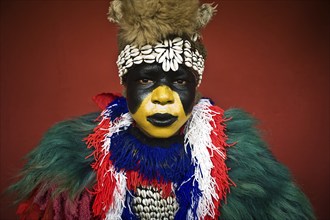 Portrait of a Zimba performer Gambia . Zimba dancers dress like a lion. While performing, they