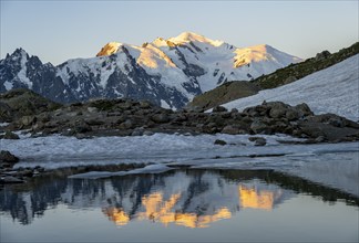 Morning atmosphere, mountain landscape at sunrise, reflection in Lac Blanc, glaciated mountain peak