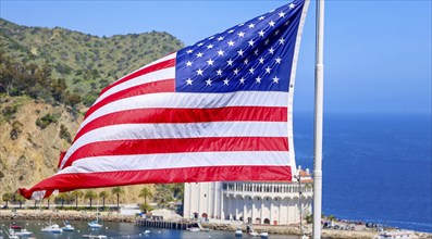 American star spangled flag waving in California. A large American flag is flying high above