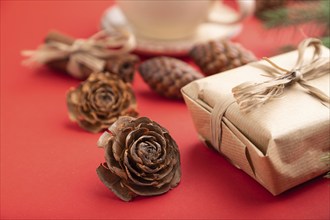 Christmas or New Year composition. Decorations, box, cinnamon, cones, fir and spruce branches, cup