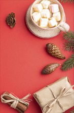 Christmas or New Year composition. Decorations, box, cinnamon, cones, fir and spruce branches, cup