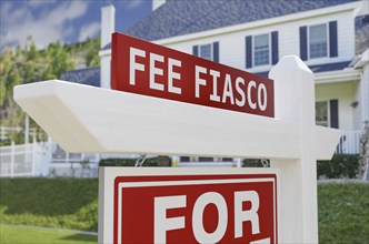 Fee fiasco for sale real estate sign in front of new house