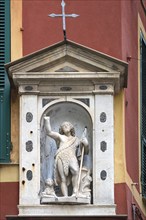 Jesus with a lamb, figures on a corner house in the historic centre, Aenua, Italy, Europe