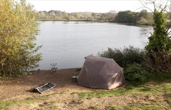 Fishing tent at Big Fish lake at Suffolk water park, Bramford, Suffolk, England, UK