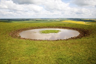 Dew pond water supply on the top of Tan Hill, All Cannings, Wiltshire, England, United Kingdom,