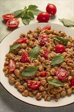 Tuscan pasta with smoked paprika and basil, parmesan cheese, Italian traditional cuisine