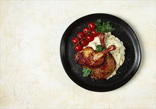 Fried duck shank, cauliflower puree, cherry tomatoes, homemade, no people