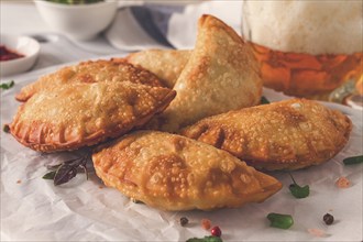 Fried chebureks, close-up, on a light background, no people