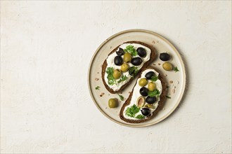 Breakfast, sandwiches, with cream cheese, olives, top view