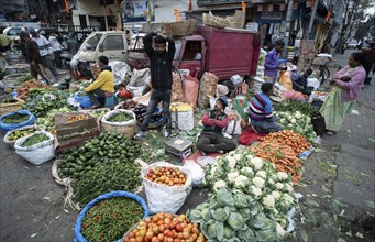 Vendor selling vegetables at a market, ahead of the presentation of the Interim Budget 2024 by