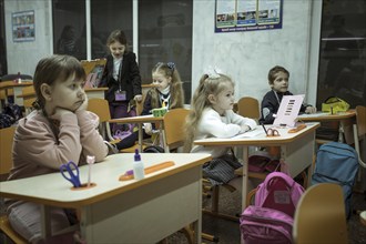 Pupils in a classroom in one of the metro schools in Kharkiv. Classrooms were set up in various