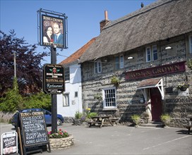 Rose and Crown pub, Tilshead, Wiltshire, England, UK, sign of Prince William and his wife Kate