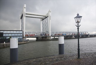 Spoorbrug or railway bridge over Oude Maas river at Dordrecht, Netherlands which is raised to allow