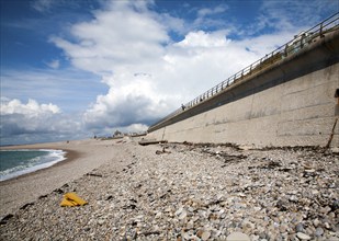 Shingle beach and large sea wall providing coastal defence at Chiswell, Isle of Portland, Dorset,