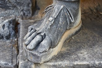 Close-up of the base of an ancient stone statue, exterior, Archaeological Museum, Archea Korinthos,