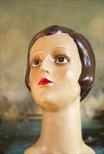 Female mannequin head close up 1920s haircut style, inside antiques centre, Marlesford Mill,