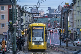 Ruhrbahn tram, on Altendorfer Straße, in the background the skyline of Essen city centre, rush