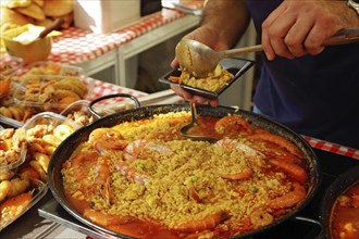 Paella preparation, street market stand near Barcelona Cathedral square