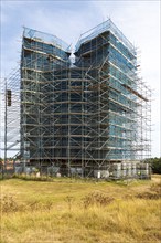 Orford Castle surrounded by scaffolding during restoration project by English Heritage, Orford,