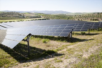 Array of photovoltaic solar panels in Mediterranean sunshine, near Alhama de Granada, Spain, Europe