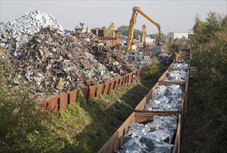 Scrap metal recycling loading train wagons with processed metals, EMR company, Swindon, England, UK