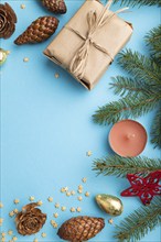 Christmas or New Year composition. Decorations, box, cinnamon, cones, fir and spruce branches, cup