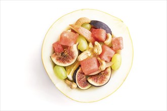 Vegetarian fruit salad of watermelon, grapes, figs, pear, orange, cashew isolated on white