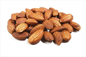 Pile of sweet almond nut isolated on white background. Closeup