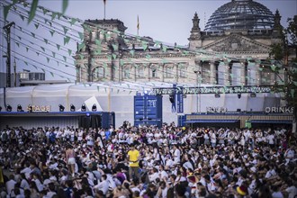 Scenes in the fan zone on Platz der Republik in front of the Reichstag building taken in Berlin, 29