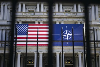 The flags of the USA and NATO hang on a building in Washington on the sidelines of the NATO summit.