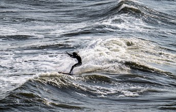 Scheveningen beach, strong swell, surfers, Netherlands