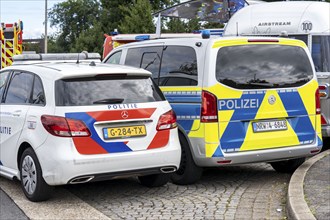 Patrol cars of the North Rhine-Westphalia police and the Dutch police, Politie, during a joint