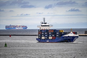 Entry to the seaport of Rotterdam, container freighter, feedership, Samskip Endeavour, enters the