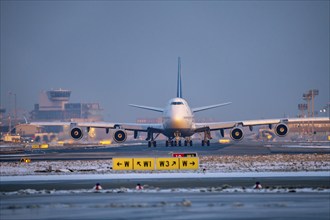 Lufthansa Boeing 747-8, on the taxiway to Runway West, Frankfurt FRA Airport, Fraport, in winter,