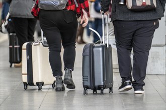 Travellers with luggage, suitcases on a platform, North Rhine-Westphalia, Germany, Europe