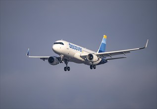 Discover Airbus A320-200, on approach to Frankfurt FRA Airport, Fraport, in winter, Hesse, Germany,