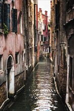 Waterway with alley in the old town, old building, city trip, holiday, travel, tourism, lagoon