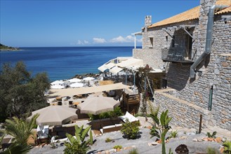 A cosy restaurant with parasols and views of the turquoise sea, Limeni, Areopoli, Laconia,