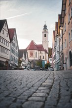 Historic old town with cobblestones, church and half-timbered houses in the morning light, Horb,