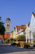 Facade of the savings bank, tower of St. Johannes, colourful houses, Lange Zeile, Erding, Upper