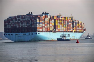 Harbour tugs bring the container freighter Madison Maersk from its berth at the RWG Container