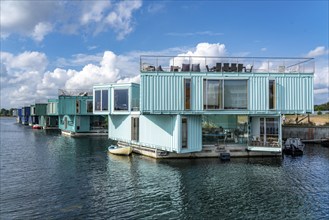 Urban Rigger, a floating village made of freight containers, for students, action against the