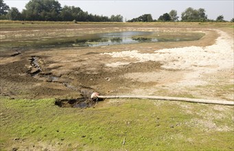 27 July 2017 Low water level in farm irrigation lake after long summer drought, Sutton, Suffolk