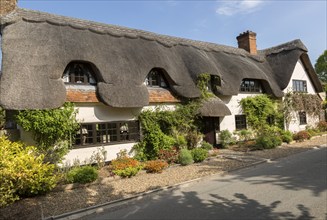 Attractive traditional thatched cottage at West Amesbury, Woodford Valley, Wiltshire, England, UK