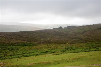 Grey overcast weather clouds hanging over moorland, Dartmoor national park, near Postbridge, Devon,